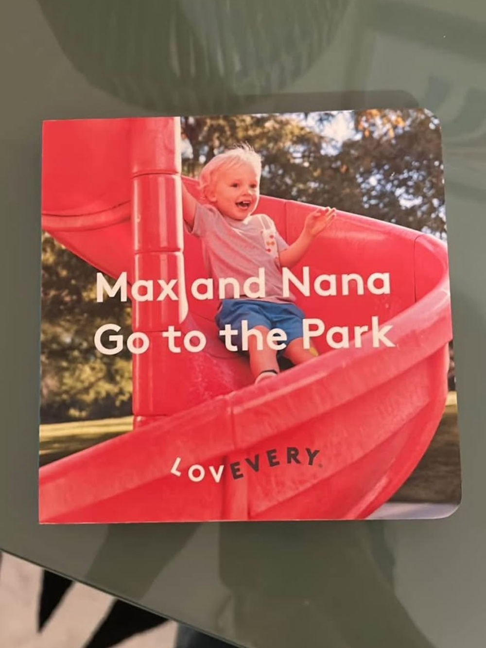 Lovevery Kids Board Book - Max and Nana Go to the Park (Red)